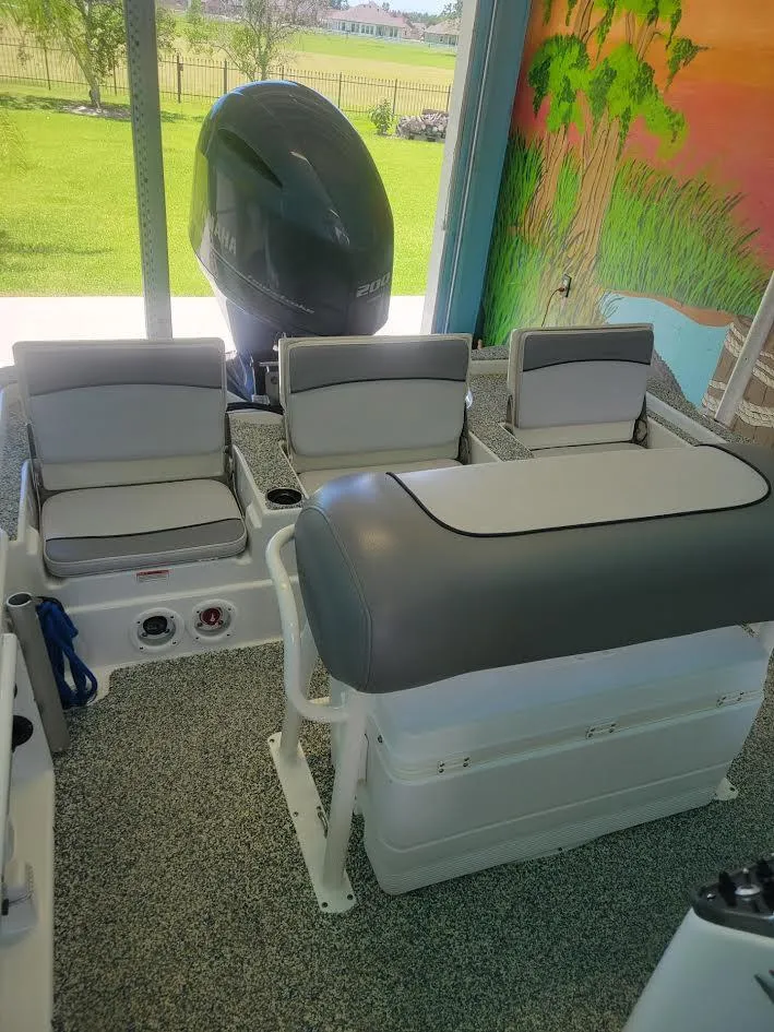 Slide: The Image of 2021 NauticStar 215 XTS boat interior with seating and motor. - 4