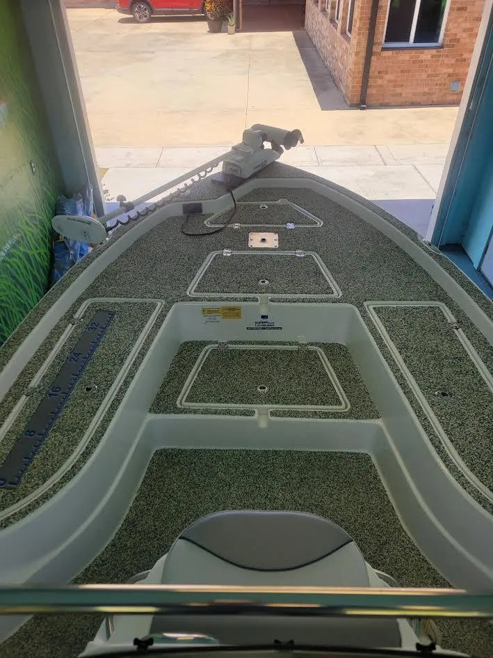 Slide: The Image of 2021 NauticStar 215 XTS boat interior with fishing deck and storage compartments. - 6