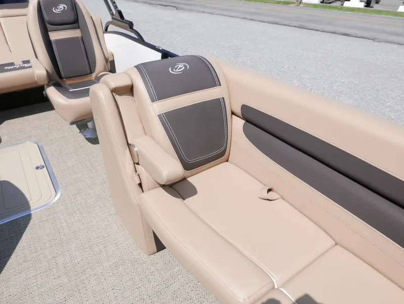 Slide: The Image of 2025 Barletta Cabrio 24UC boat interior with beige and brown seating. - 11