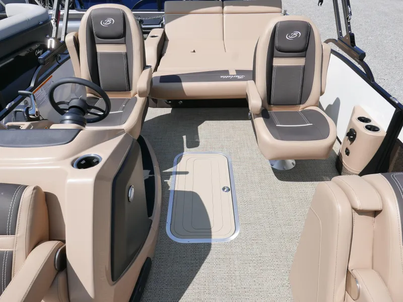 Slide: The Image of 2025 Barletta Cabrio 24UC interior with beige seating and steering wheel. - 12