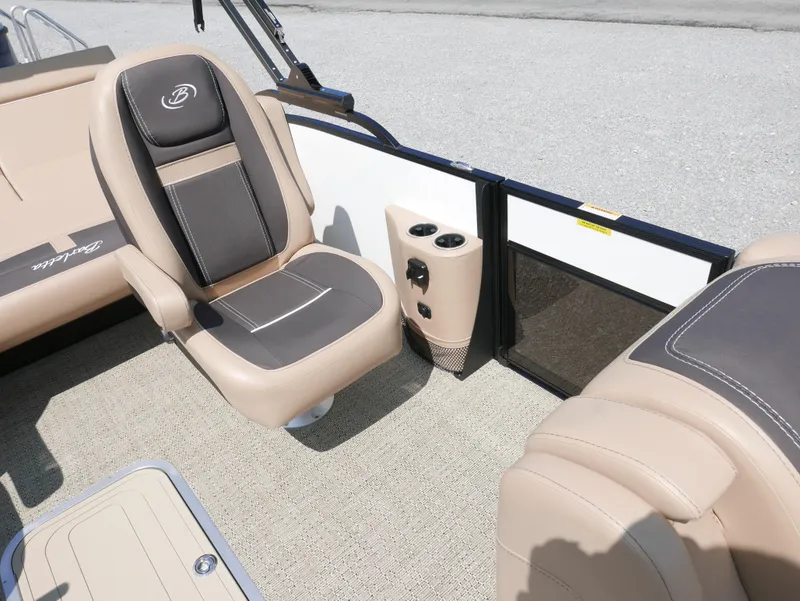 Slide: The Image of 2025 Barletta Cabrio 24UC interior with beige seating and cup holders. - 13