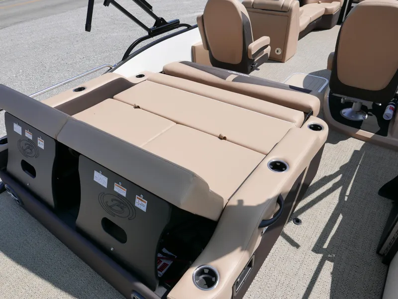 Slide: The Image of 2025 Barletta Cabrio 24UC boat interior with beige seating and cup holders. - 23