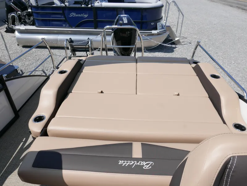 Slide: The Image of 2025 Barletta Cabrio 24UC boat with tan seating and sleek design. - 24