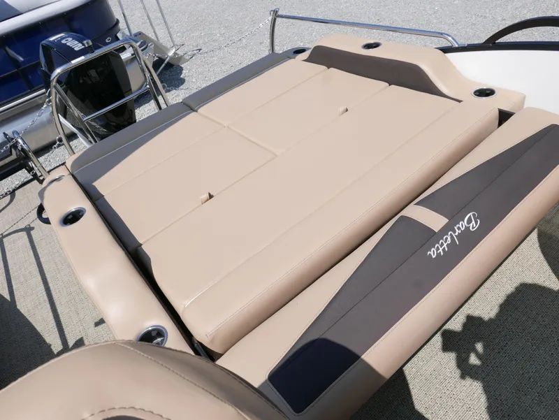 Slide: The Image of 2025 Barletta Cabrio 24UC boat with tan seating and sleek design. - 25