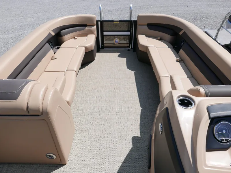 Slide: The Image of 2025 Barletta Cabrio 24UC pontoon boat interior with beige seating and modern design. - 5
