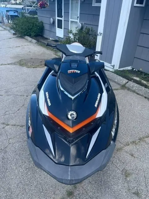 Slide: The Image of 2012 Sea-Doo GTI SE 155 jet ski parked on concrete driveway. - 3