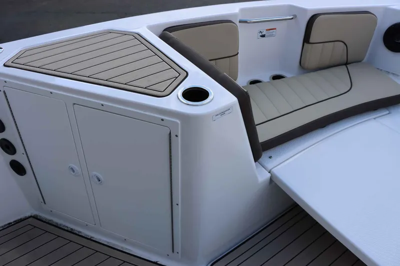 Slide: The Image of 2025 Yamaha Boats 222FSH SPORT E interior seating and storage area. - 12