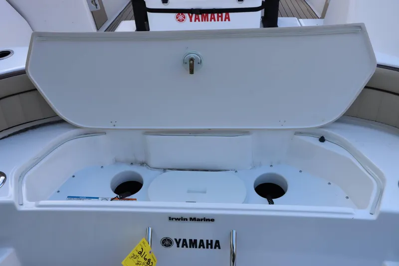 Slide: The Image of 2025 Yamaha Boats 222FSH SPORT E storage compartment open on deck. - 19