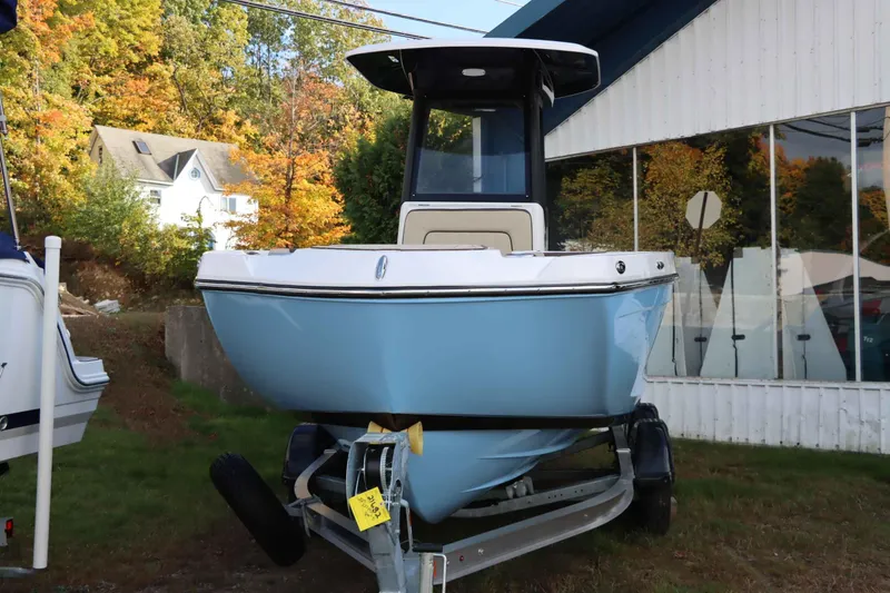 Slide: The Image of 2025 Yamaha Boats 222FSH SPORT E on trailer, displayed outdoors in autumn setting. - 3