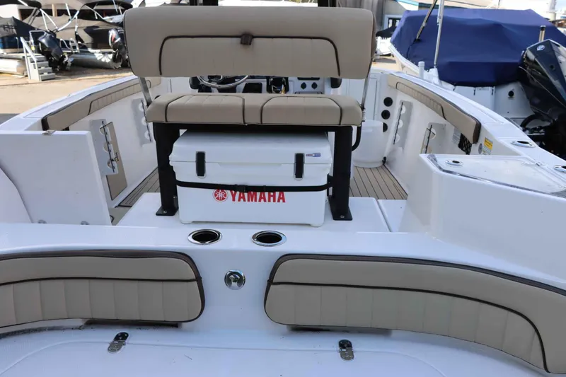 Slide: The Image of 2025 Yamaha Boats 222FSH SPORT E interior with seating and storage. - 6