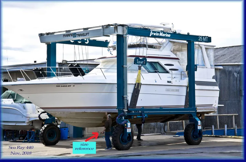Slide: The Image of 1989 Sea Ray 440 Aft Cabin yacht on a marine travel lift. - 11