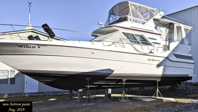 Slide: The Image of 1989 Sea Ray 440 Aft Cabin yacht on stands, new bottom paint, August 2019. - 12