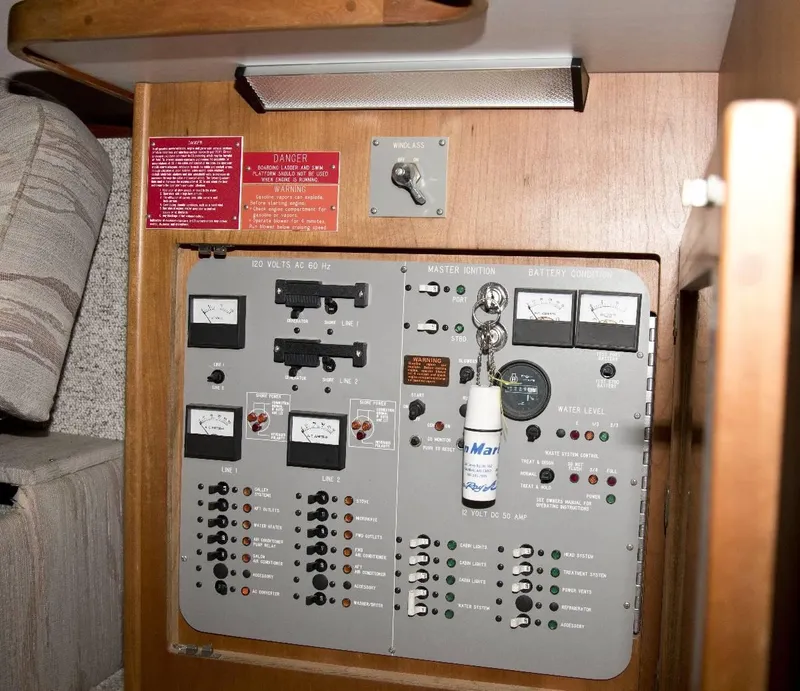 Slide: The Image of Control panel of a 1989 Sea Ray 440 Aft Cabin boat, featuring various switches and gauges. - 30