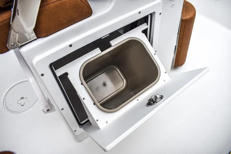Slide: The Image of 2025 Sea Hunt Ultra 255 SE boat storage compartment with stainless steel interior. - 4