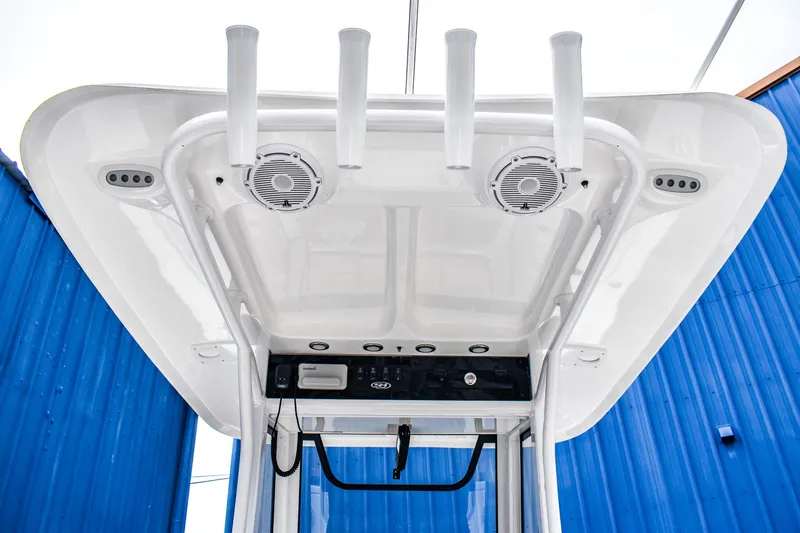 Slide: The Image of 2025 Sea Hunt Ultra 255 SE boat roof with speakers and rod holders. - 6