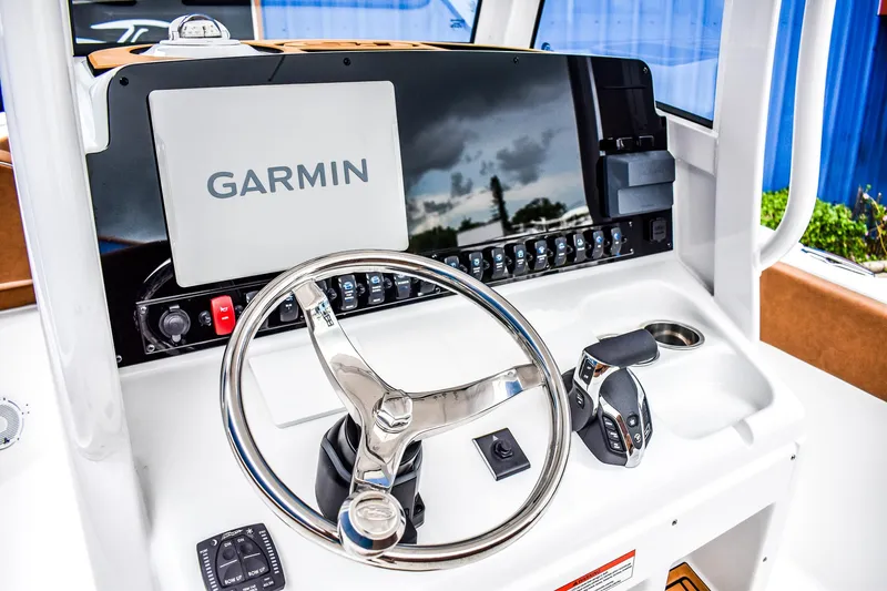 Slide: The Image of 2025 Sea Hunt Ultra 255 SE boat dashboard with Garmin navigation system. - 7
