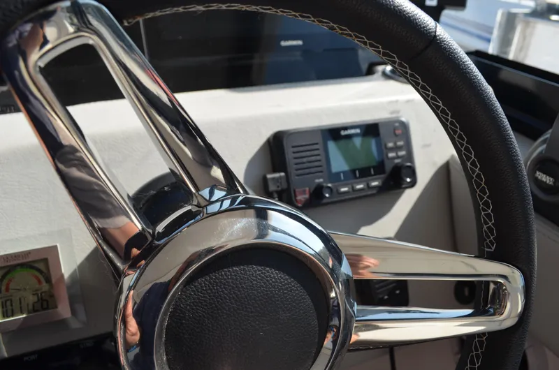 Slide: The Image of Steering wheel of 2023 Regal 36 Grande Coupe with navigation display. - 10