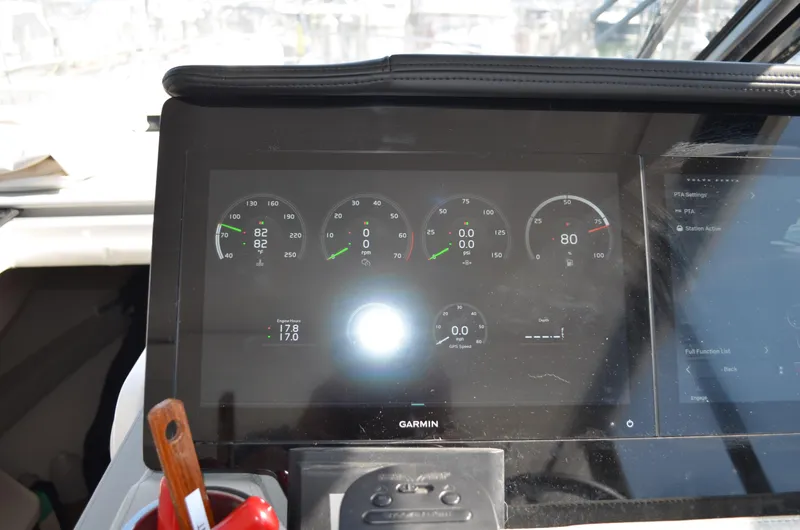Slide: The Image of Dashboard of 2023 Regal 36 Grande Coupe with digital gauges and Garmin display. - 30