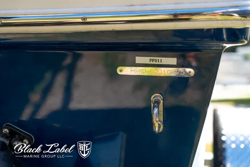 Slide: The Image of 2025 Hewes 18 Redfisher boat detail with Black Label Marine Group logo. - 13