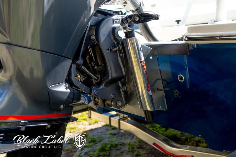 Slide: The Image of 2025 Hewes 18 Redfisher boat engine detail, featuring Black Label Marine Group branding. - 14