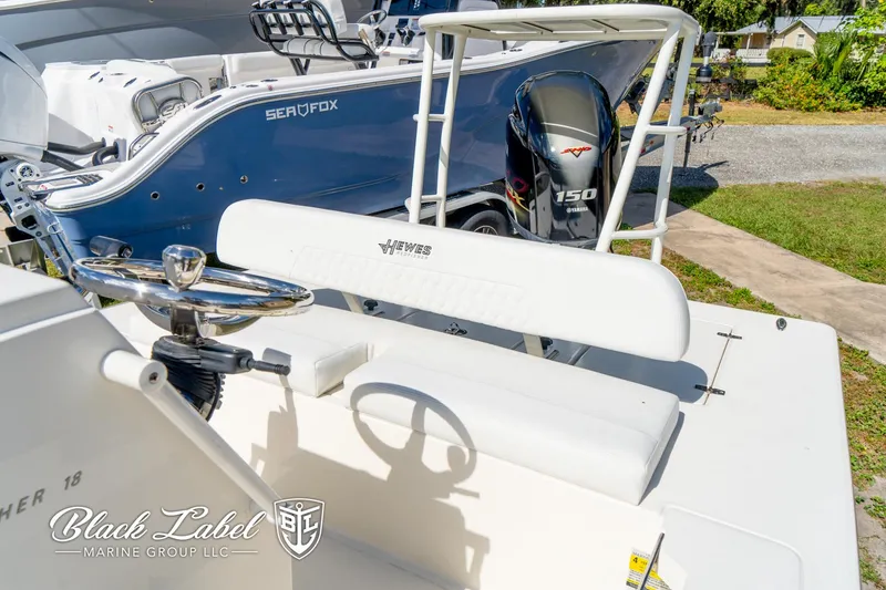 Slide: The Image of 2025 Hewes 18 Redfisher boat with Yamaha 150 engine, showcased by Black Label Marine Group. - 9