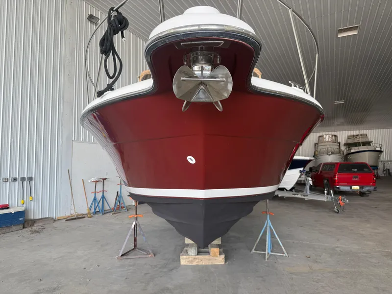 Slide: The Image of 2004 Tiara Yachts 2900 Coronet in storage, rear view, elevated on stands. - 4