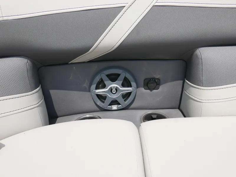 Slide: The Image of Barletta Cabrio 24UE 2025 boat interior with speaker and cup holders. - 10