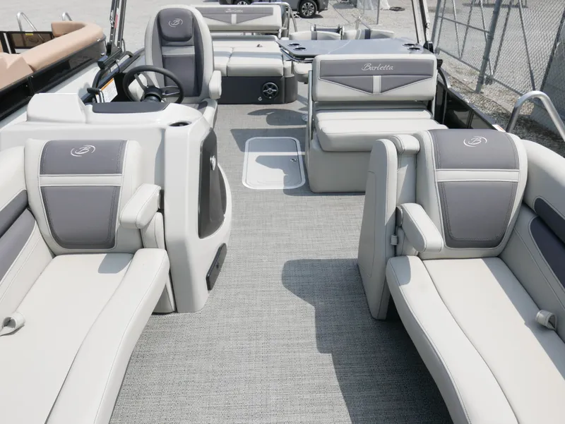 Slide: The Image of 2025 Barletta Cabrio 24UE pontoon boat interior with luxurious seating and modern design. - 12