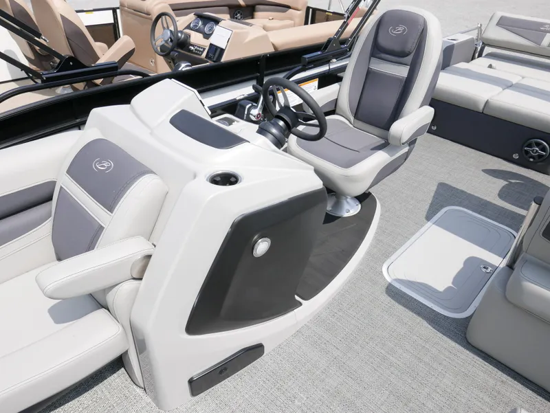 Slide: The Image of 2025 Barletta Cabrio 24UE boat interior with modern helm and seating. - 18