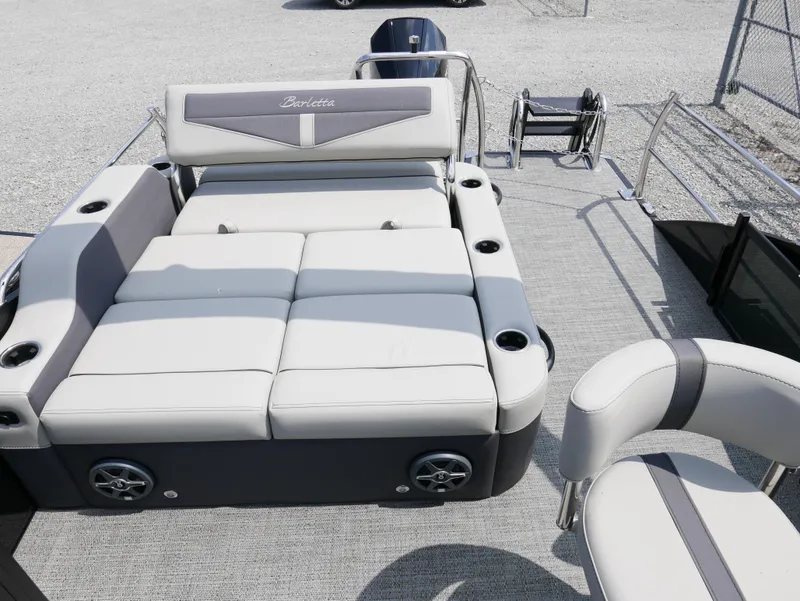 Slide: The Image of 2025 Barletta Cabrio 24UE pontoon boat with spacious seating and modern design. - 24