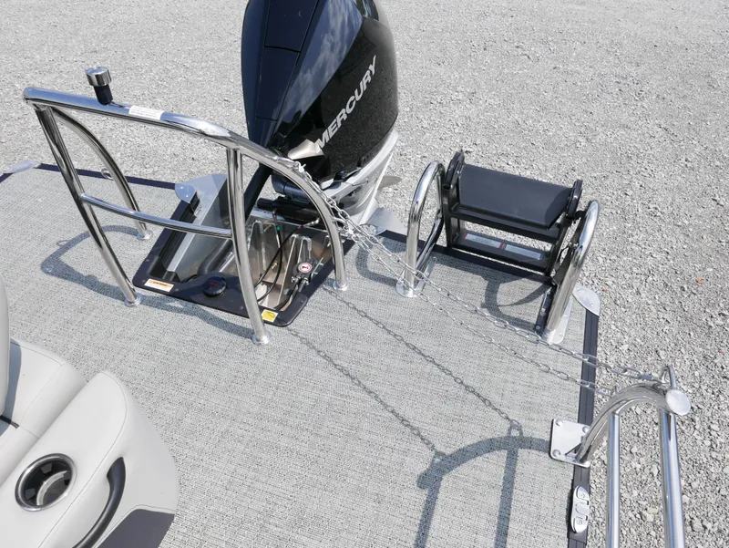 Slide: The Image of Barletta Cabrio 24UE 2025 boat deck with Mercury engine and seating area. - 25