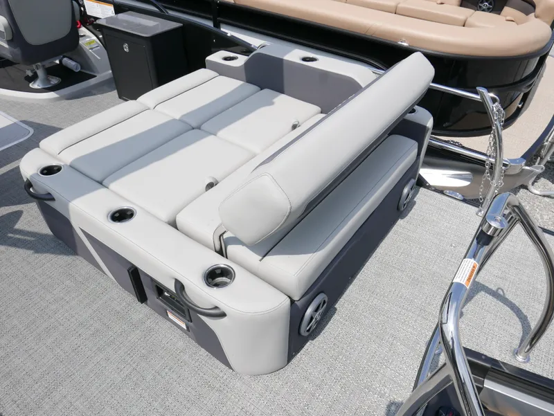 Slide: The Image of 2025 Barletta Cabrio 24UE boat interior with adjustable seating and cup holders. - 26