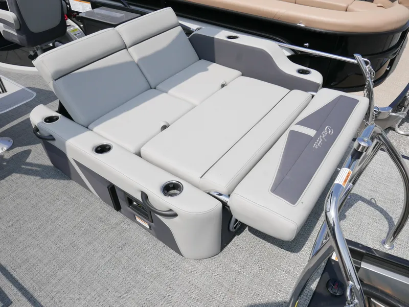 Slide: The Image of 2025 Barletta Cabrio 24UE boat with luxurious gray seating and cup holders. - 28