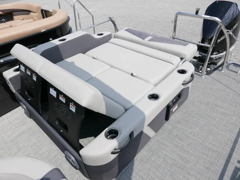 Slide: The Image of 2025 Barletta Cabrio 24UE boat seating area with cup holders and modern design. - 29
