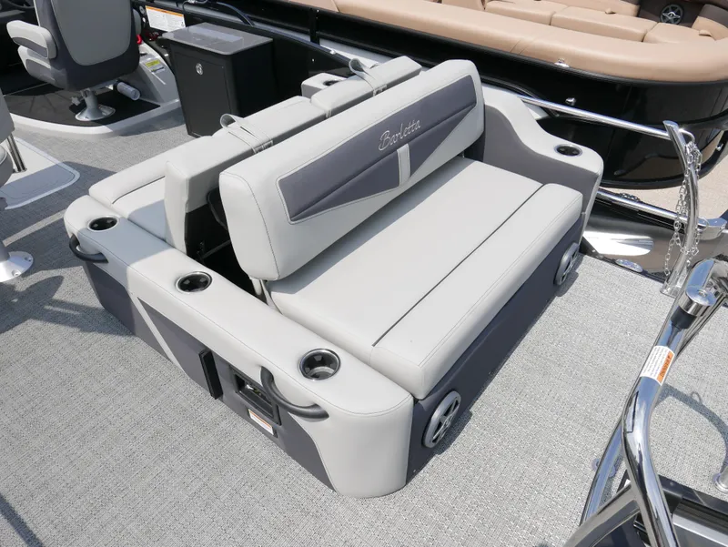 Slide: The Image of 2025 Barletta Cabrio 24UE boat seating with cup holders and sleek design. - 30