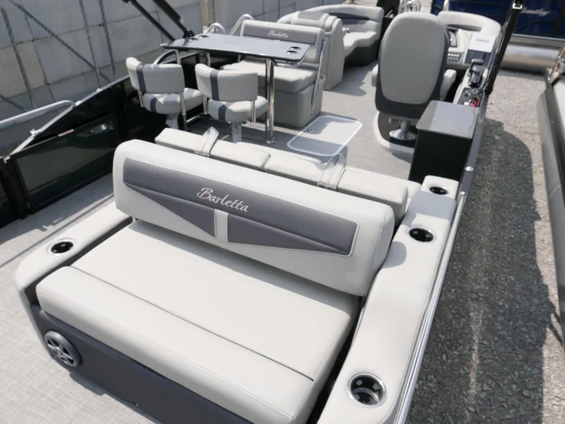 Slide: The Image of 2025 Barletta Cabrio 24UE pontoon boat with luxurious seating and modern design. - 31