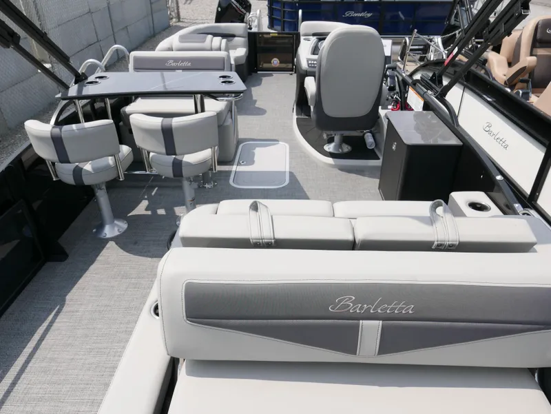 Slide: The Image of 2025 Barletta Cabrio 24UE pontoon boat interior with seating and helm. - 32