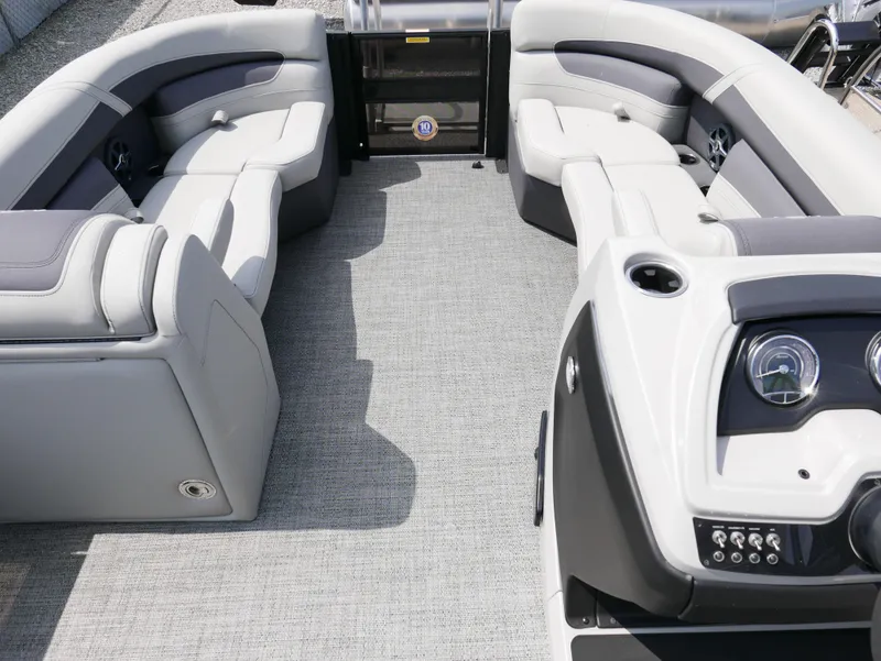 Slide: The Image of 2025 Barletta Cabrio 24UE pontoon boat interior with plush seating and modern dashboard. - 7