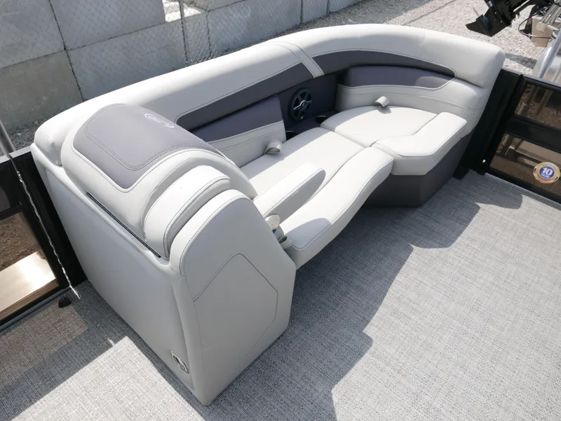 Slide: The Image of 2025 Barletta Cabrio 24UE boat interior with luxurious gray seating. - 9