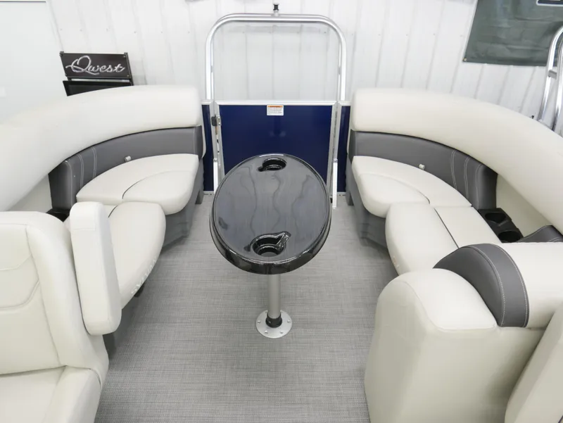 Slide: The Image of 2025 Sylvan Mirage 8520 LZ interior with plush seating and central table. - 17