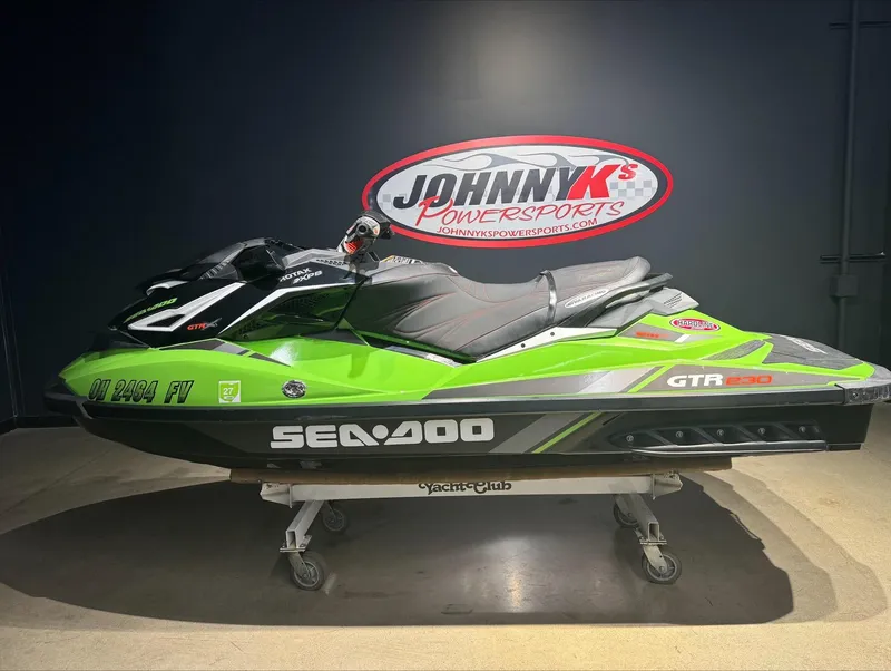 Slide: The Image of 2017 Sea-Doo GTR-X 230 jet ski in green and black at Johnny K's Powersports. - 0