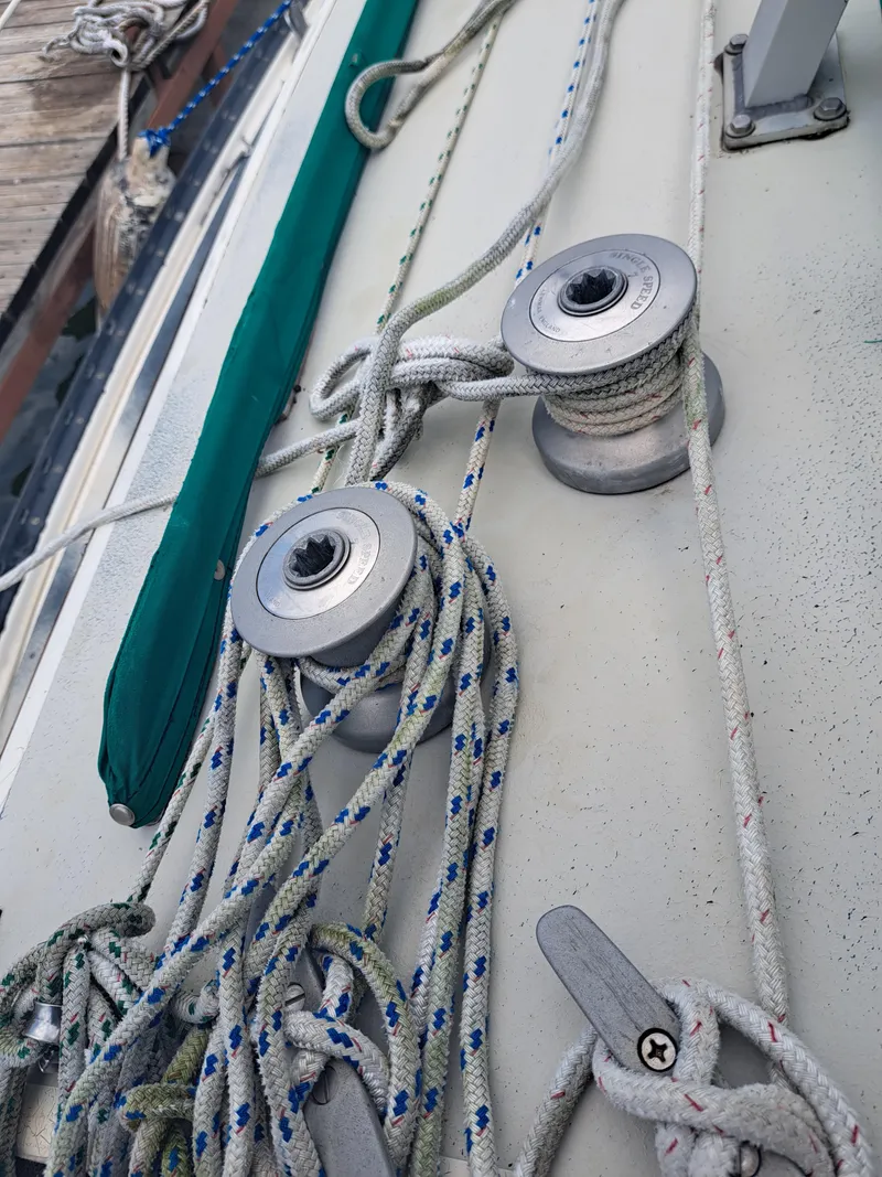 Slide: The Image of Close-up of 1979 Newport Mark II sailboat winches and ropes on deck. - 14