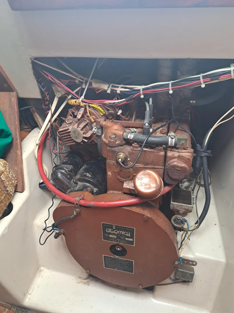 Slide: The Image of 1979 Newport Mark II engine compartment with wiring and mechanical components. - 32