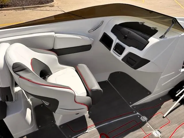 Slide: The Image of Interior of 2023 Tahoe 210 S Limited boat with modern seating and dashboard. - 10