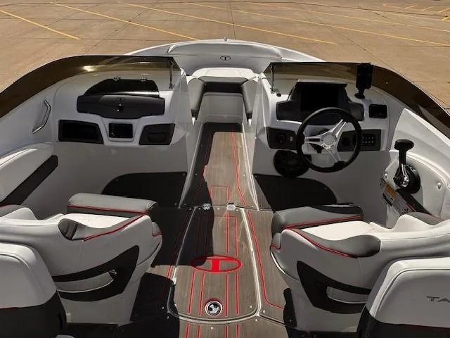 Slide: The Image of 2023 Tahoe 210 S Limited boat interior with modern dashboard and seating. - 14