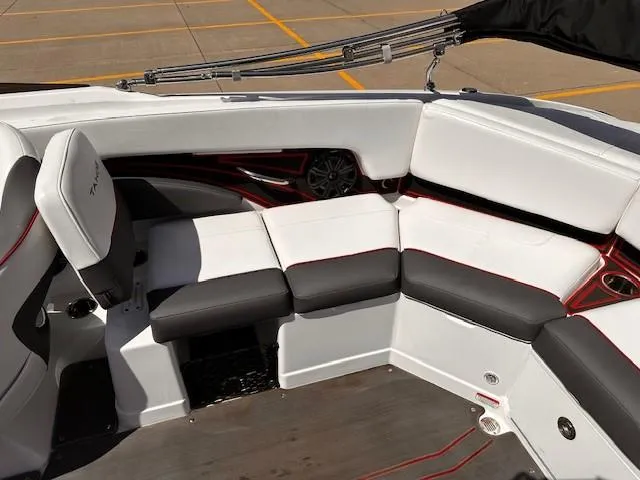 Slide: The Image of 2023 Tahoe 210 S Limited boat interior with white and black seating. - 6