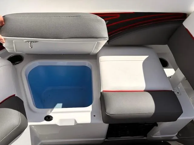 Slide: The Image of 2023 Tahoe 210 S Limited boat seating with storage compartment open. - 9