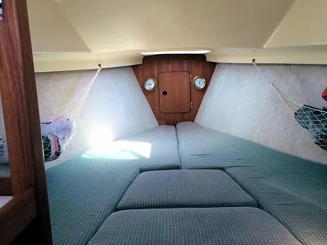 Slide: The Image of Interior cabin of a 1988 Quickstep 24 sailboat with cozy sleeping area. - 7