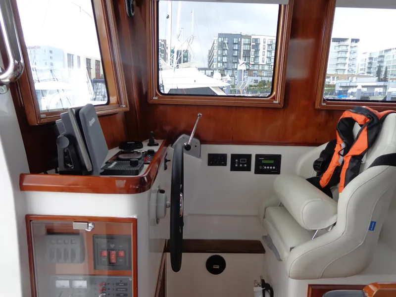 Slide: The Image of 2020 SeaPiper Pilothouse interior with navigation controls and captain's chair. - 15
