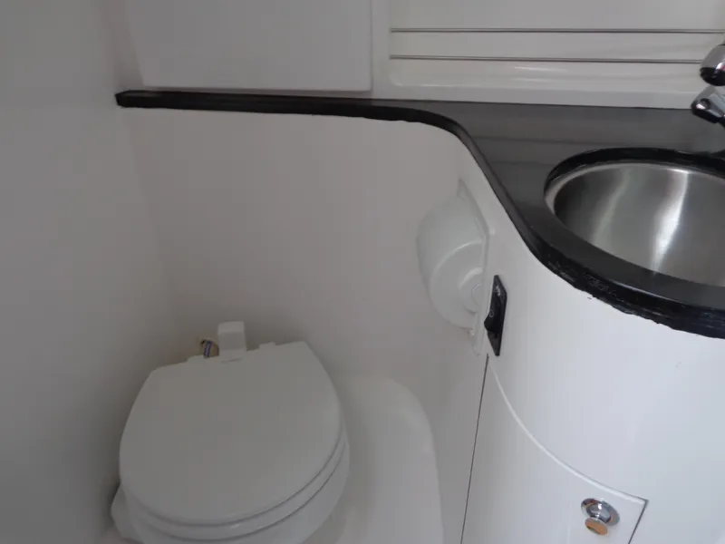 Slide: The Image of 2020 SeaPiper Pilothouse bathroom with toilet and sink. - 28